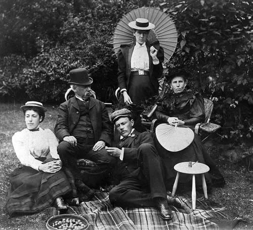 a group of people sitting on a bench